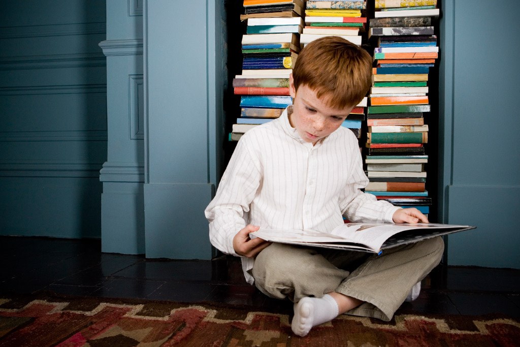 boy-reading-book-sitting-on-the-floor-ages9-11.jpg